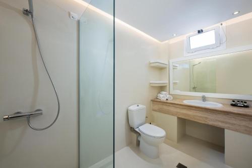 a bathroom with a shower and a toilet and a sink at Alexandros Palace in Ouranoupoli