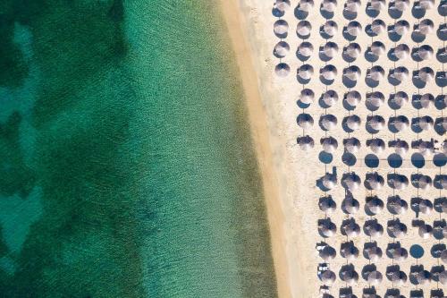 an aerial view of a beach with umbrellas at Alexandros Palace in Ouranoupoli