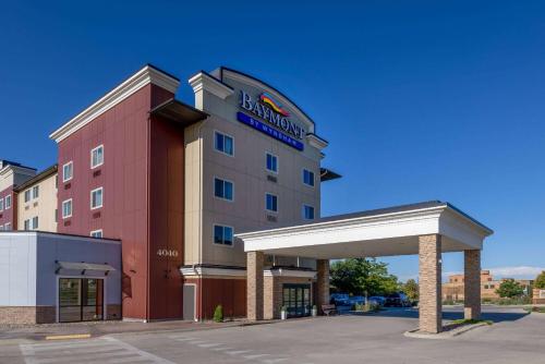 a hotel with a sign on the front of it at Baymont by Wyndham Rapid City in Rapid City