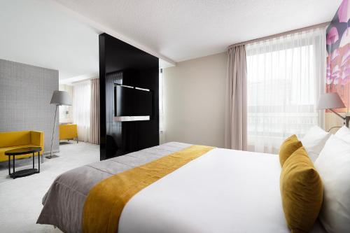 Ένα ή περισσότερα κρεβάτια σε δωμάτιο στο Mercure Lublin Centrum