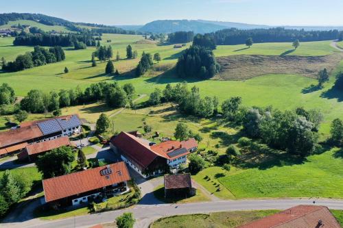 an aerial view of a house in a green field at Lina in Rottenbuch