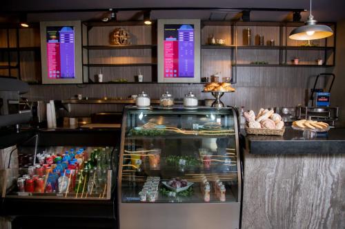 a display case in a restaurant with food at Camino Real Fashion Drive Monterrey in Monterrey