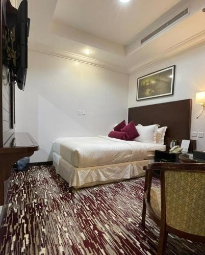Postel nebo postele na pokoji v ubytování Carawan Al Khaleej Hotel Olaya