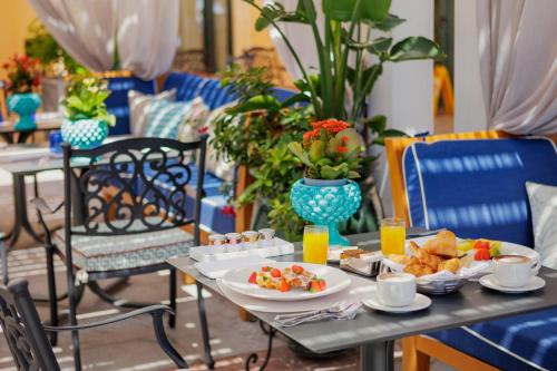 a table with plates of food on top at Grand Hotel San Pietro Taormina in Taormina