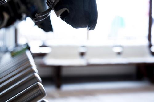 a close up of a bench in front of a table at der grüne Baum Mountain Boutique Hotel in Ehrwald