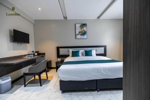Postel nebo postele na pokoji v ubytování Hotel Lourdes, Siaya