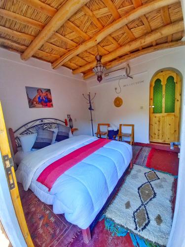 Ένα ή περισσότερα κρεβάτια σε δωμάτιο στο Maison d'Hôte Argana