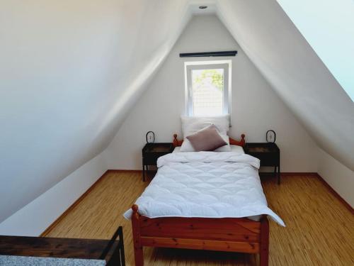 a bedroom with a bed in a attic at Theox No 13 - 6 Pers - Senseo in Heppenheim an der Bergstrasse