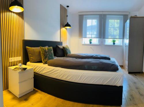 a bedroom with a large bed in a room at Ferienhaus Doina in Gehlberg