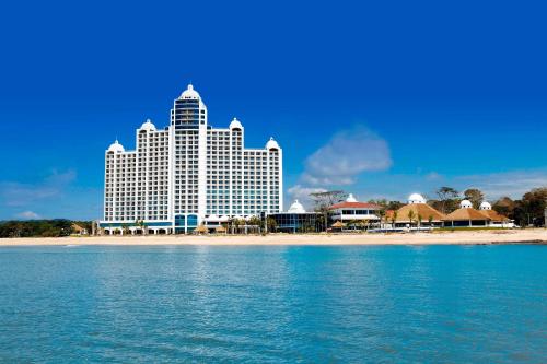 a large hotel on the beach with the water at The Westin Playa Bonita Panama in Playa Bonita Village