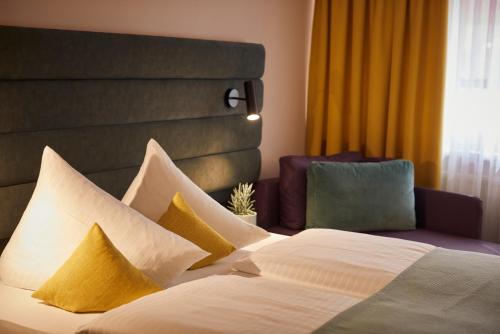 Hotel Mirabell by Maier Privathotelsにあるベッド