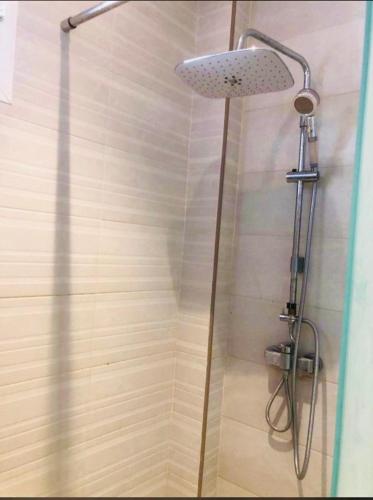 a shower with a shower head in a bathroom at HASSAN in Rabat