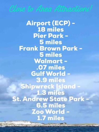 a white sign with the names of the cities in the ocean at Beachfront Studio #1112 at Majestic in Panama City Beach