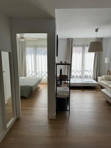 Кровать или кровати в номере Plaza Victoria Apartments