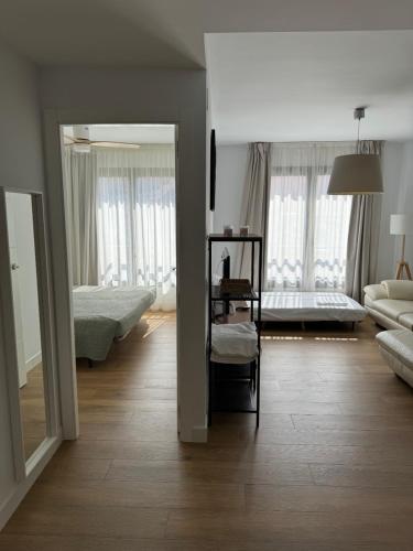 Posteľ alebo postele v izbe v ubytovaní Plaza Victoria Apartments