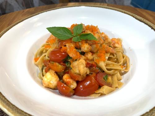 a plate of pasta with meat and tomato sauce at Krua Chehe Resort ครัวเจ๊ะเห รีสอร์ท in Ban Khok Muang