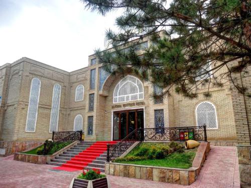 a large church with red carpeted steps in front of it at Sangzor Boutique Hotel in Samarkand
