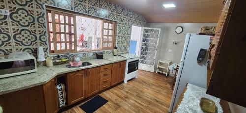 Kuchyň nebo kuchyňský kout v ubytování Casa linda e muito aconchegante em Campos do Jordão