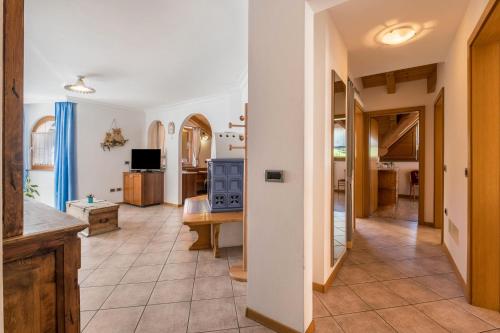 a living room with a kitchen and a dining room at Villa Lory 6 in Canazei