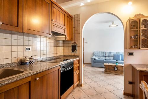 a kitchen with a sink and a stove top oven at Villa Lory 6 in Canazei