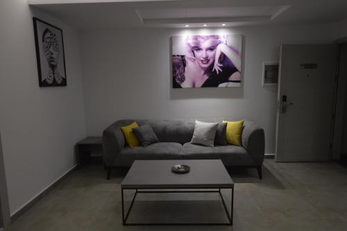 a living room with a couch and a table at Zett hotel in Jounieh