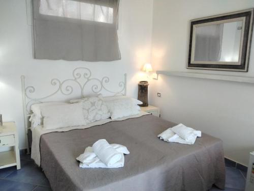Cama o camas de una habitación en Baia D'Oro