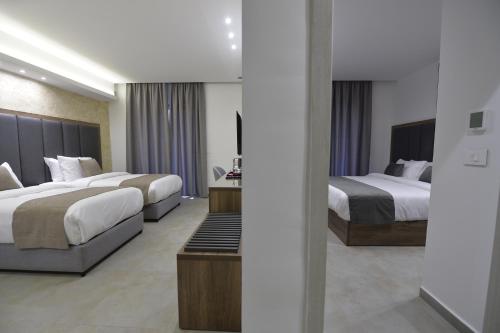a hotel room with two beds at Zett hotel in Jounieh