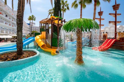a pool with a water park with slides and palm trees at Hotel Best Lloret Splash in Lloret de Mar