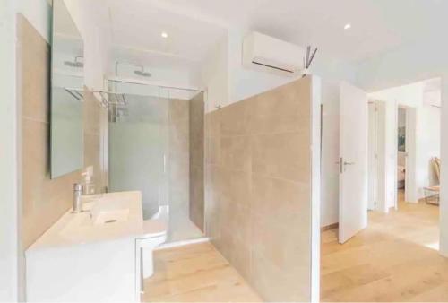 a bathroom with a sink and a mirror at Villa Arbona Dalt in Sóller