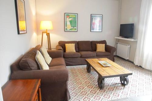 Posezení v ubytování Cal Cinto · Apartamento rústico y renovado 7p