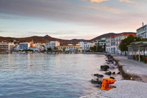 a view of a river in a city with buildings at En Tino 2 in Tinos Town