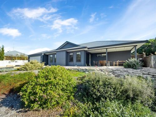a contemporary home with a gray house at Whale Tails Augusta - stylishly modern in the town of Augusta in Augusta