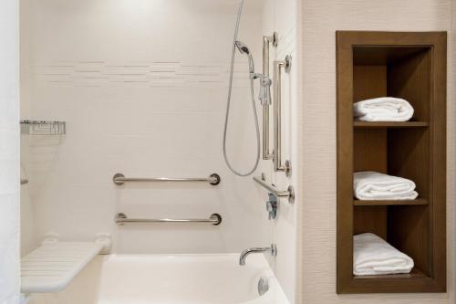 a bathroom with a shower and a sink and a toilet at Residence Inn by Marriott Phoenix Chandler/South in Chandler