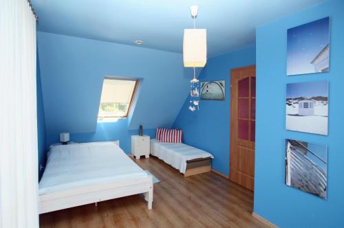 Ένα ή περισσότερα κρεβάτια σε δωμάτιο στο WYNAJEM POKOI Halina Ciesielska