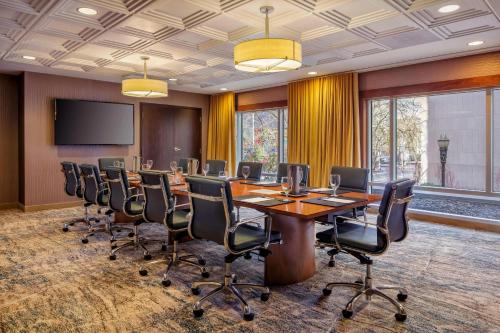 a conference room with a long table and chairs at Courtyard by Marriott Portland City Center in Portland