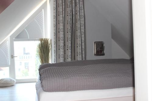 Postel nebo postele na pokoji v ubytování Ostseeresidenz Pelzerhaken