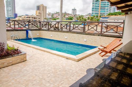 a swimming pool on top of a building at Hotel Italia Beach in Natal