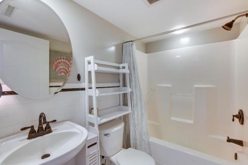 a bathroom with a sink and a toilet and a mirror at Wildwood Crest Condo Rental Walk to Beach! in Wildwood Crest