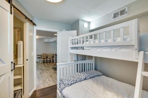 a small bedroom with a bunk bed and a staircase at Wildwood Crest Condo Rental Walk to Beach! in Wildwood Crest