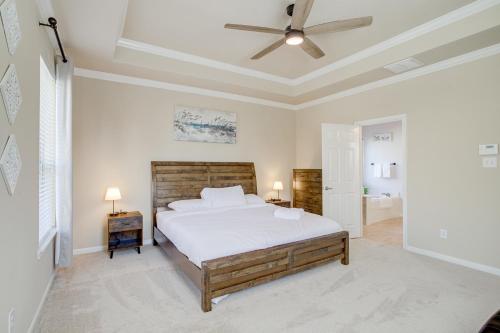 a bedroom with a bed and a ceiling fan at 4 Mi to Six Flags Spring Vacation Home in Spring