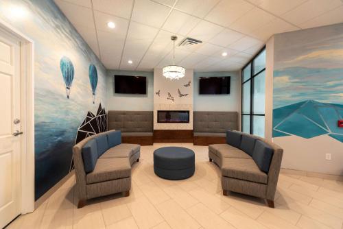 a hospital waiting room with two chairs and a table at Best Western Plus Wausau Tower Inn in Wausau