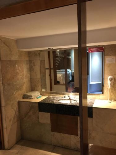 a bathroom with a sink and a mirror at San Isidro Suite in Las Heras