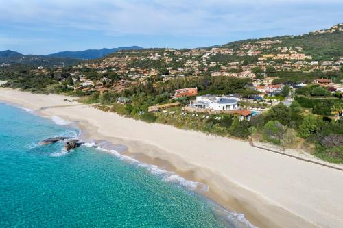 an aerial view of a beach with houses at Villa Escargot Luxury in Costa Rei Beach in Costa Rei