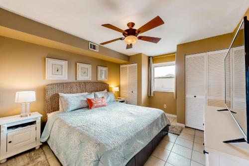 a bedroom with a bed and a ceiling fan at Jamaica IV 209 in Ocean City