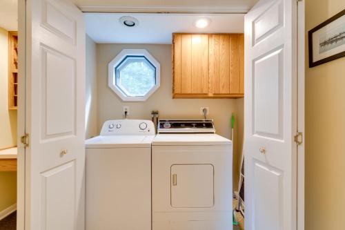 a small kitchen with a stove and a window at WolcottandPort Bay Lakehouse Your Haven on the Bay! in Wolcott