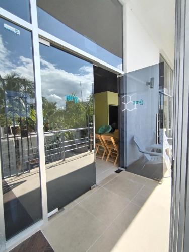 a view from the balcony of a house at Hostel Tropico 20 PDC in Playa del Carmen