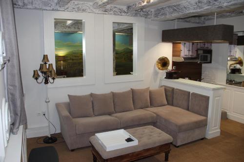 a living room with a couch and a table at VILA STASEA in Smederevo