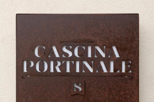 a sign that says casseramine portitaire on a wall at Cascina Portinale 8 in Alba