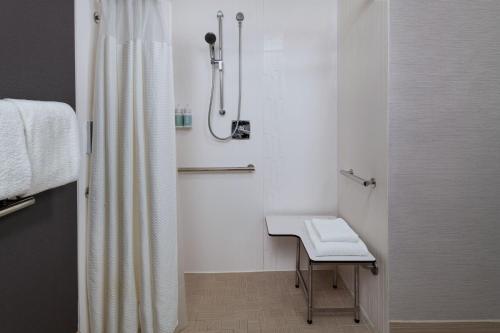 a bathroom with a shower curtain and a sink at Courtyard Fort Worth University Drive in Fort Worth