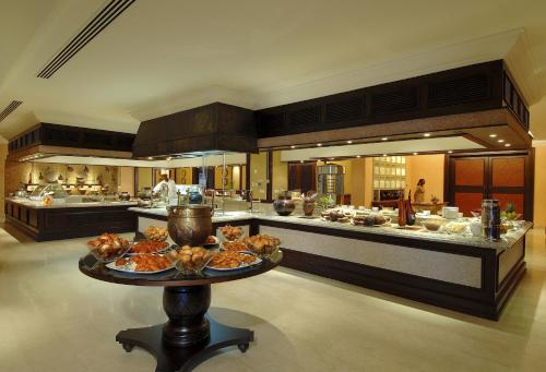 a large kitchen with a table with food on it at Djibouti Palace Kempinski in Djibouti